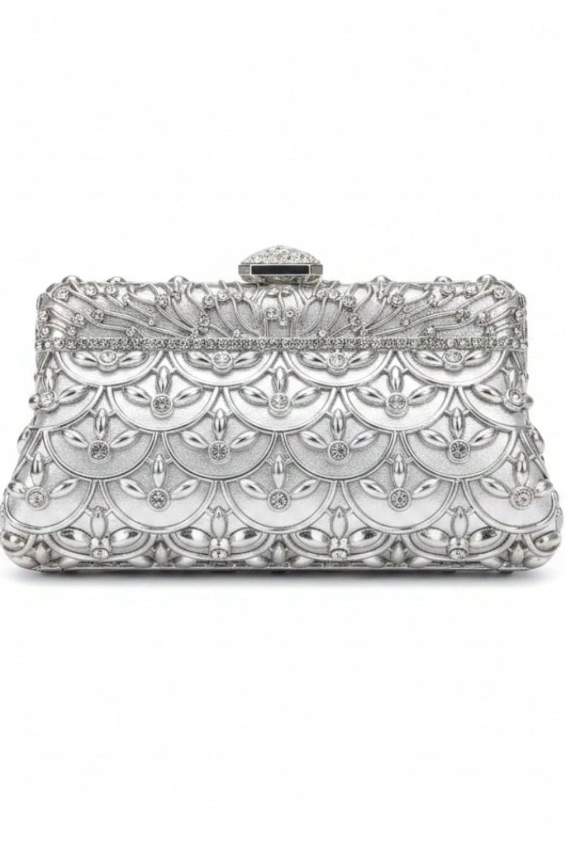 A silver metallic clutch bag with an intricate, ornate filigree pattern and a small top clasp, shown against a plain white background.