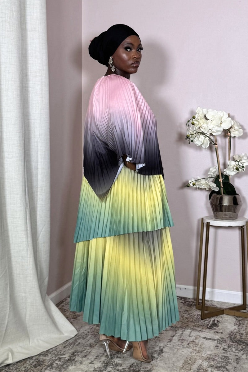 Detail of pleated pastel skirt in Aurora Meadow Bloom showing mint-to-yellow gradient.
