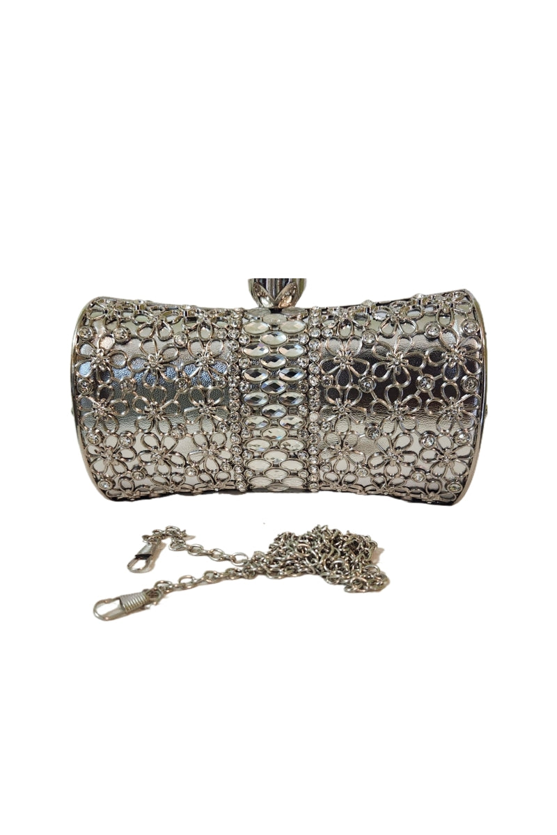 Celeste silver barrel clutch with crystal-centered floral cutouts.