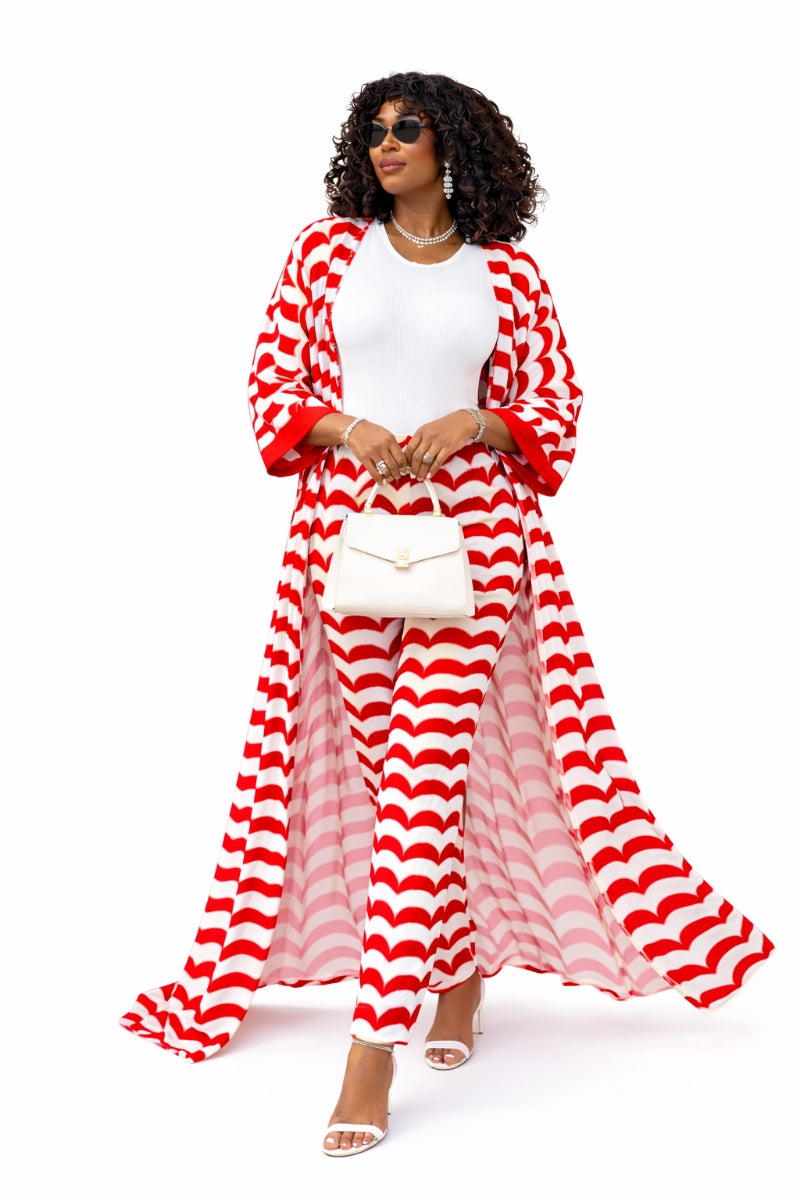 Woman wearing a red and white striped outfit on a white background