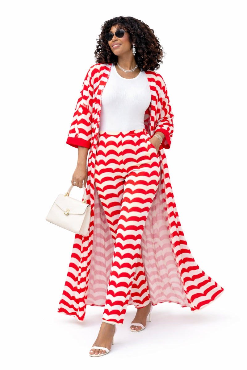 Woman wearing a red and white striped outfit with a white handbag on a white background